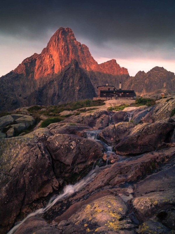 A creek and mountain in the dusk